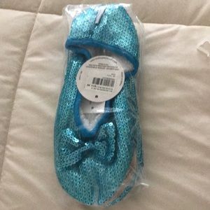 Snoozies women’s slippers.